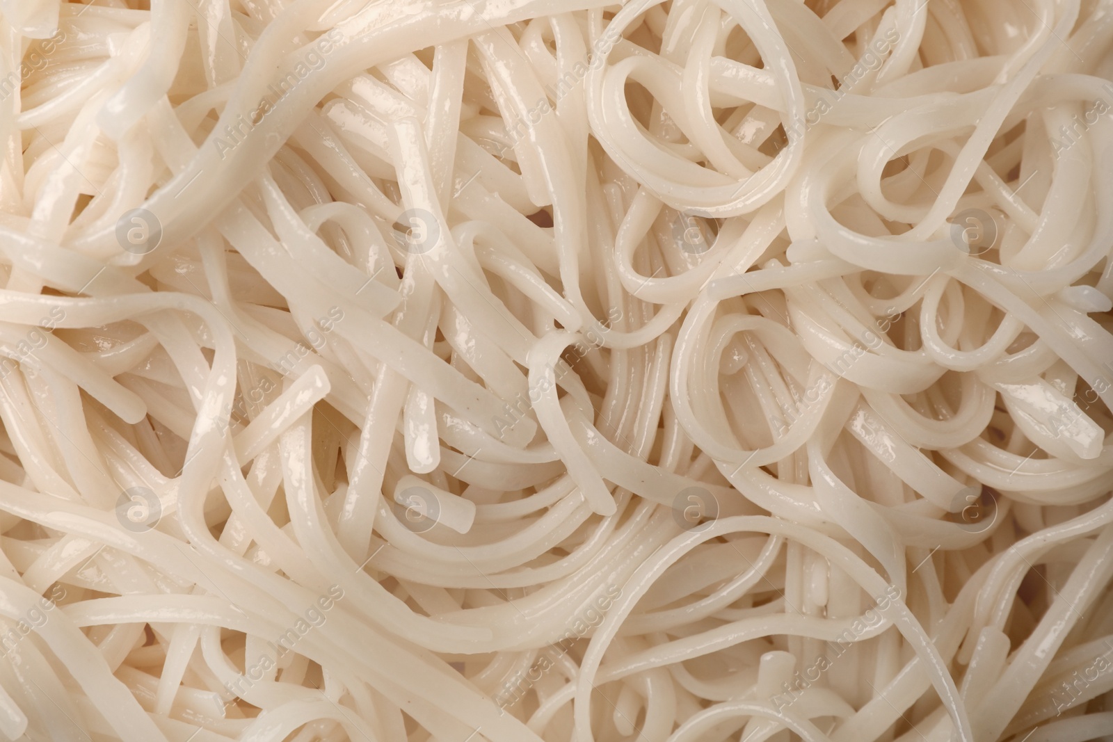 Photo of Delicious rice noodles as background, top view