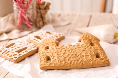 Parts of gingerbread house on table, closeup