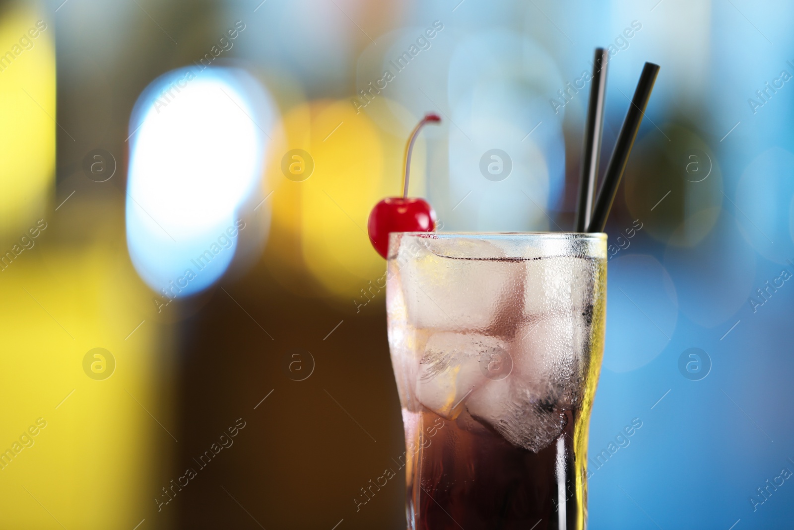 Photo of Fresh alcoholic cocktail with cherry on blurred background, closeup