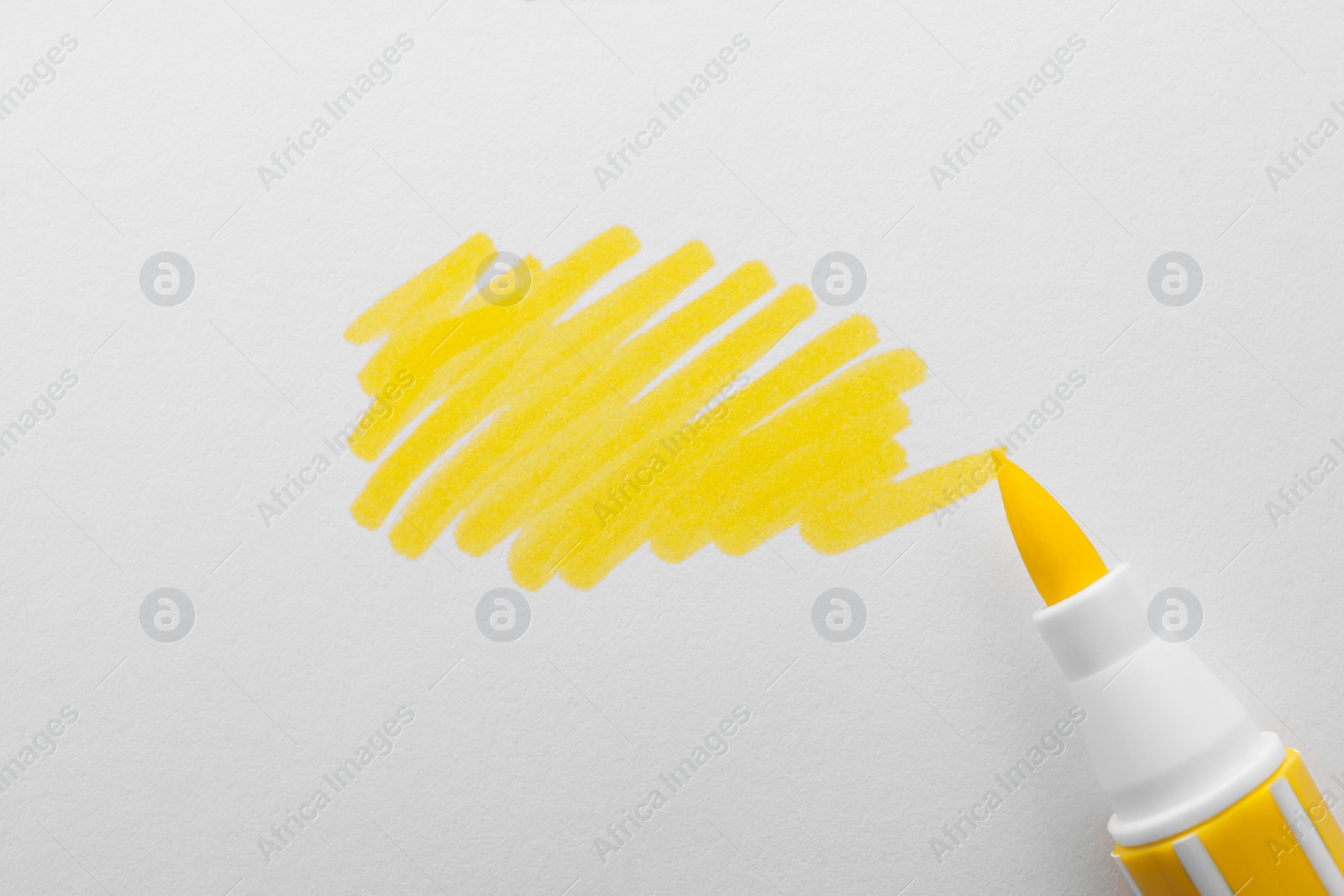 Photo of Stroke drawn with yellow marker and highlighter isolated on white, top view