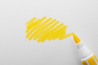 Stroke drawn with yellow marker and highlighter isolated on white, top view