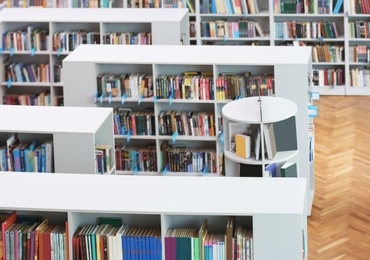 Photo of Above view of shelving units with books in library