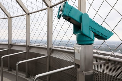 Green metal tower viewer on observation deck