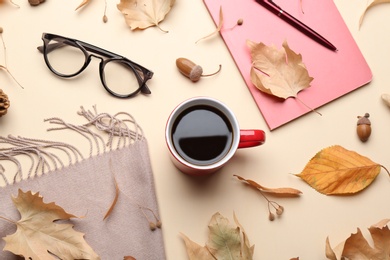 Flat lay composition with hot drink on beige background. Cozy autumn