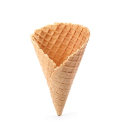 Photo of Empty crispy waffle cone for ice cream on white background