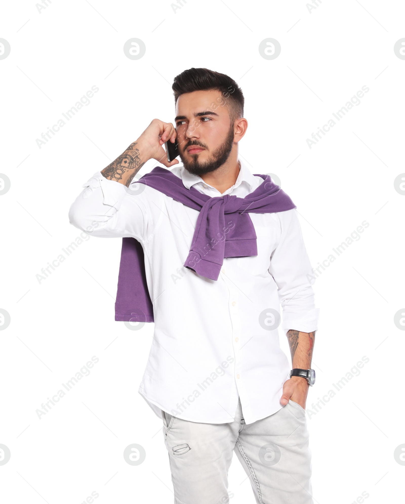 Photo of Portrait of handsome young man with mobile phone on white background