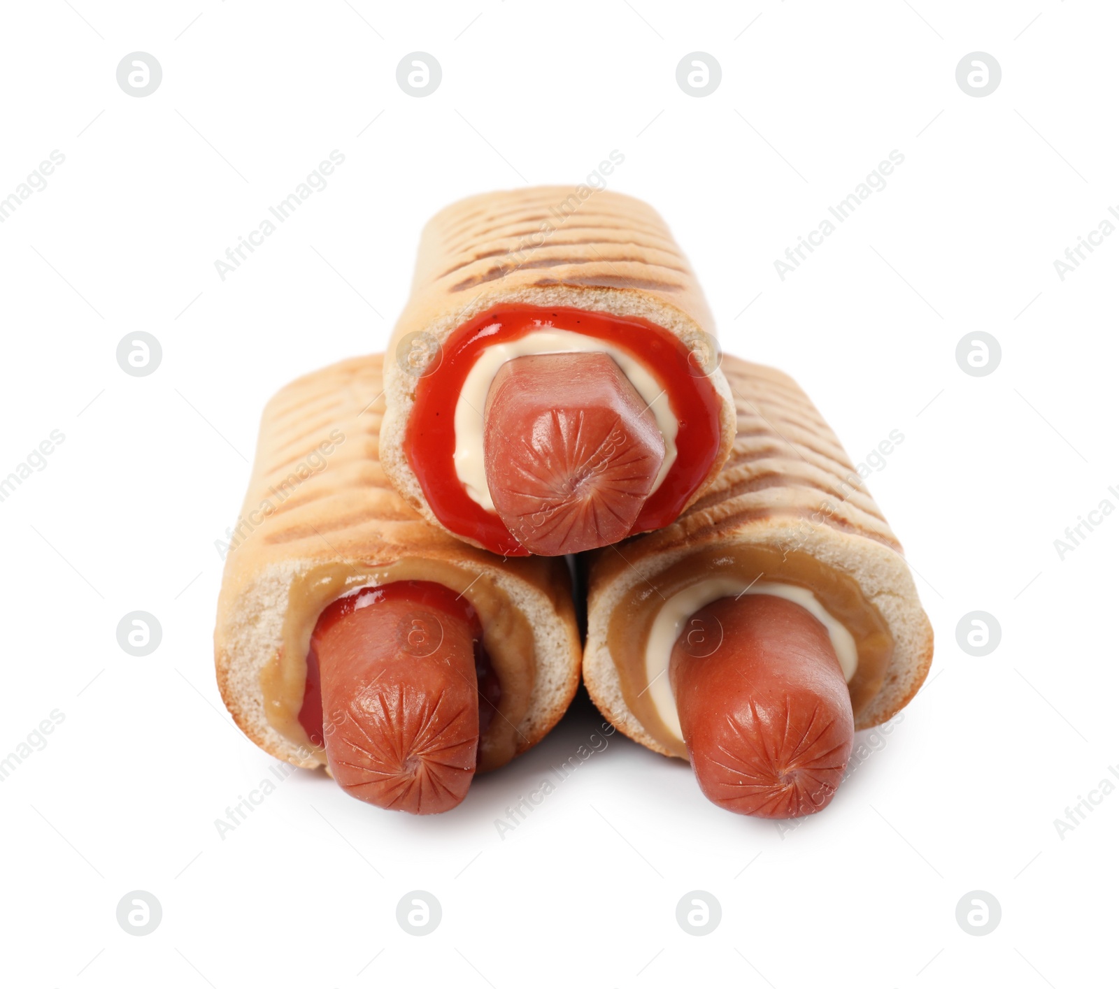 Photo of Tasty french hot dogs with different sauces on white background