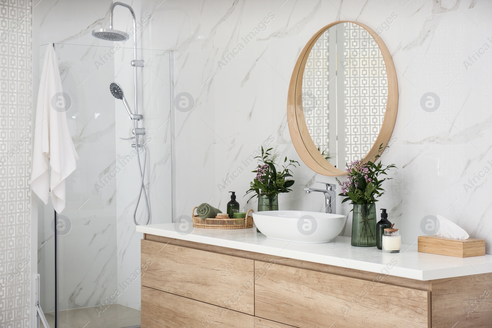 Photo of Modern bathroom interior with stylish mirror and vessel sink