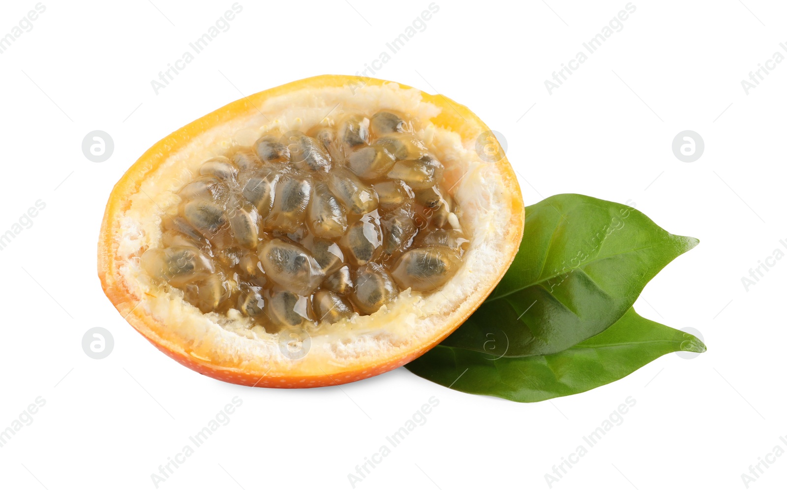 Photo of Half of delicious ripe granadilla with green leaves isolated on white