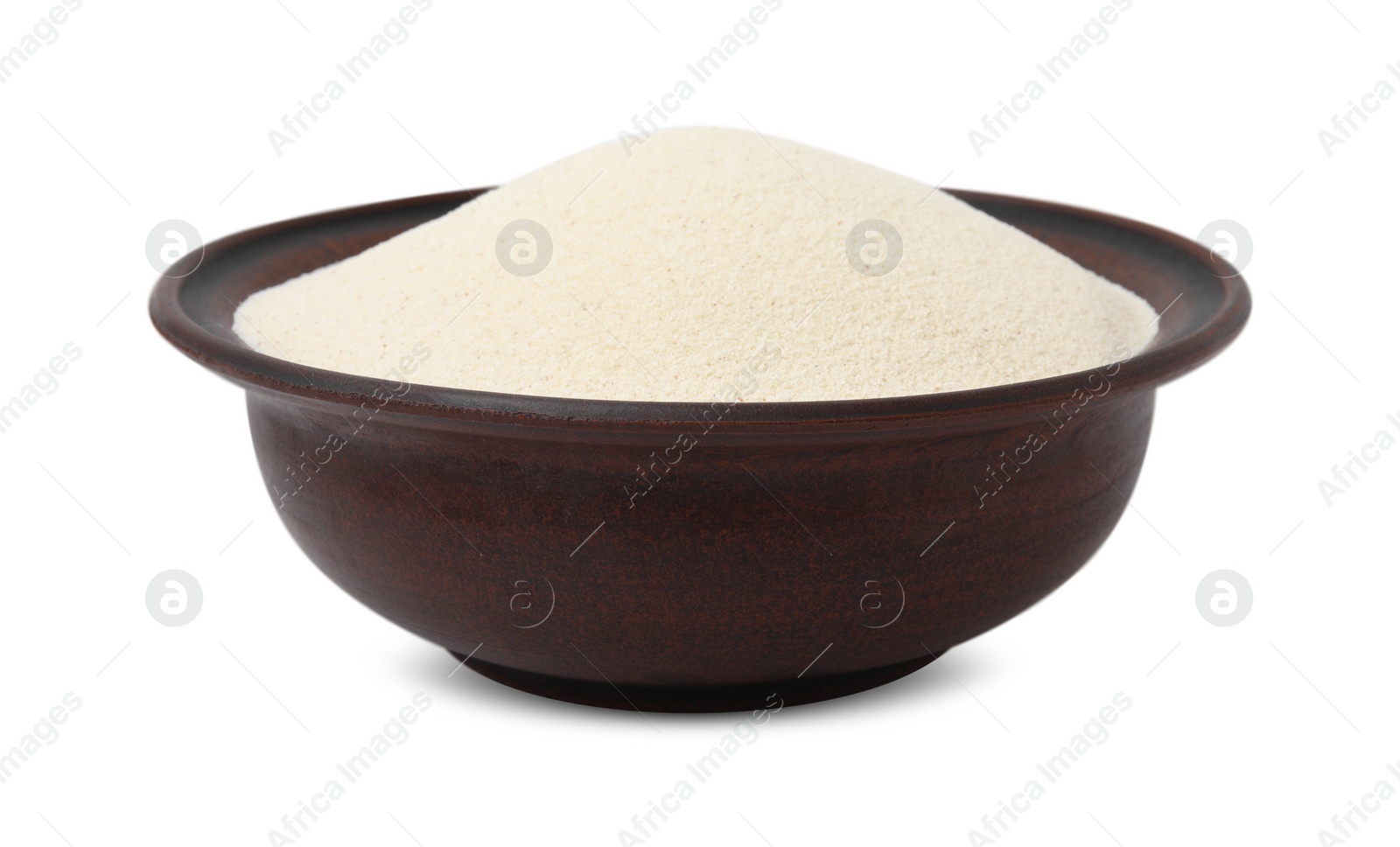 Photo of Bowl of uncooked organic semolina isolated on white