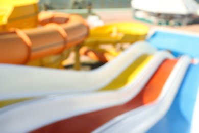 Photo of Blurred view from colorful slides in water park