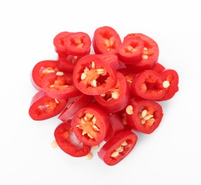 Photo of Pile of cut chili peppers on white background, top view