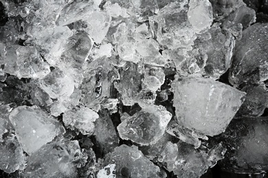 Photo of Crushed ice on black background, top view