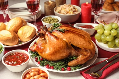 Photo of Traditional festive dinner with delicious roasted turkey served on table