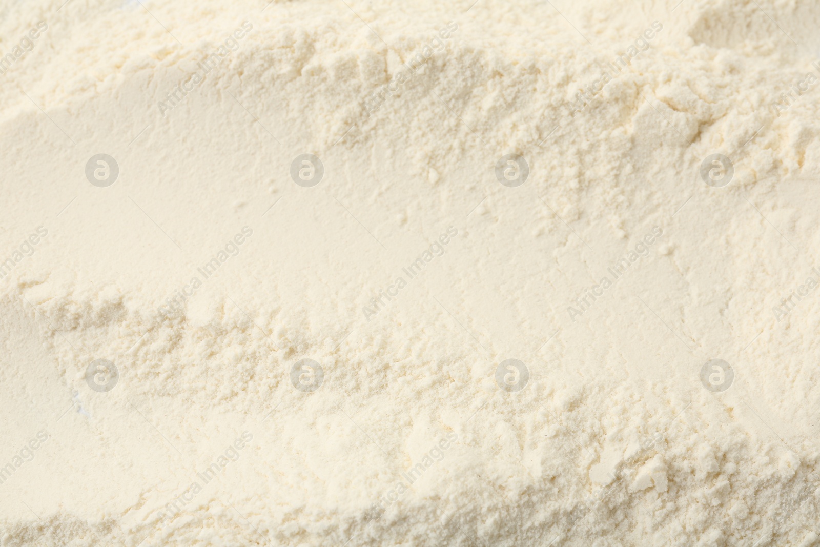 Photo of Texture of baking powder as background, top view