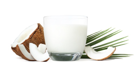 Photo of Glass of coconut milk and nuts on white background