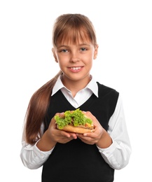 Photo of Happy girl holding burger on white background. Healthy food for school lunch