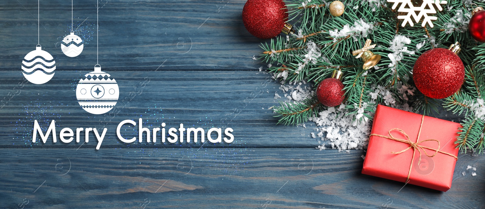 Image of Flat lay composition with text MERRY CHRISTMAS and festive decor on blue wooden background. Banner design