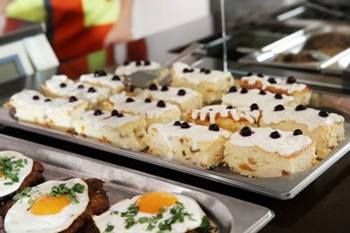 Trays with healthy food in school canteen