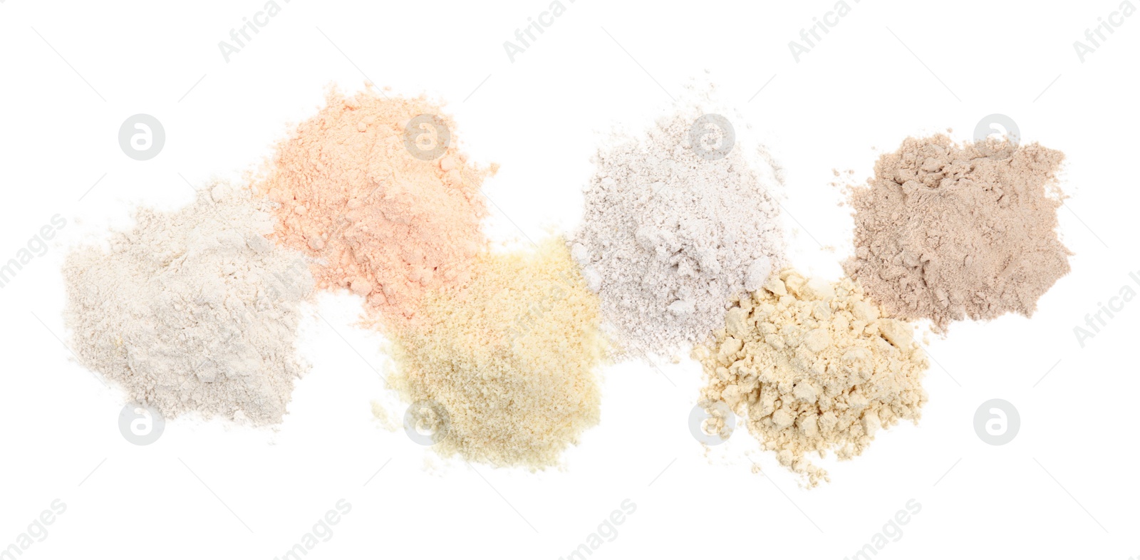 Photo of Different types of flours on white background, top view