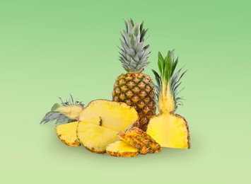 Image of Cut and whole pineapples on green gradient background