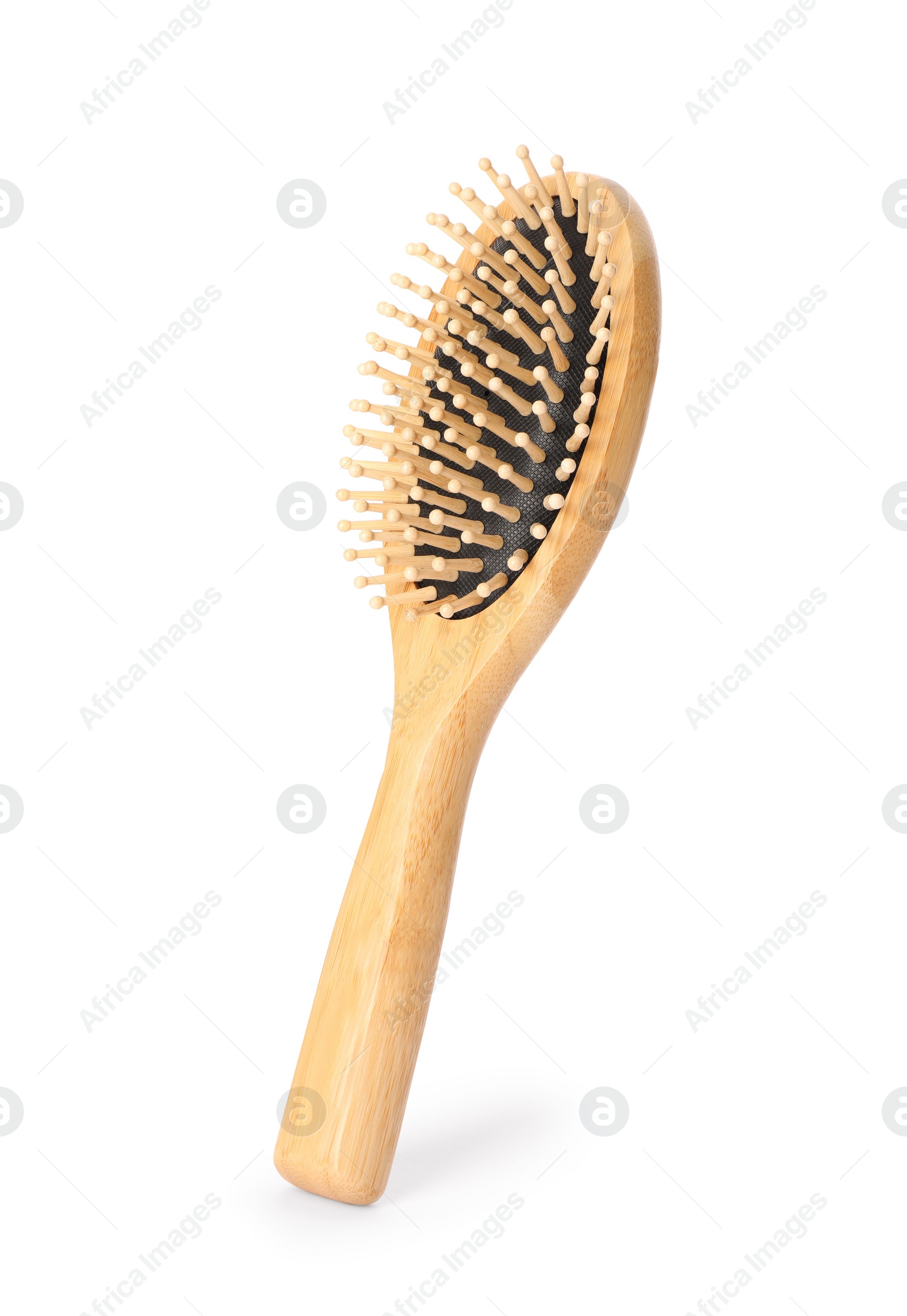 Photo of One new wooden hairbrush isolated on white