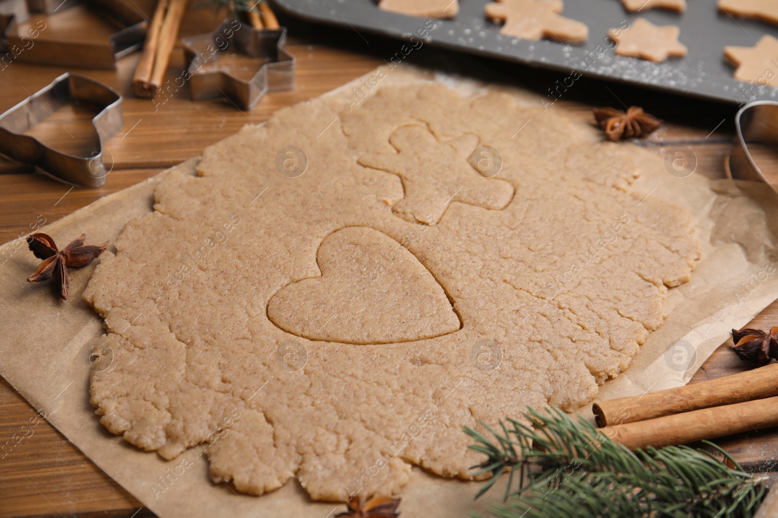 Photo of Homemade Christmas cookies. Raw dough on wooden table, closeup