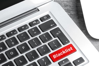 Image of Red button with word Blacklist on laptop keyboard, closeup