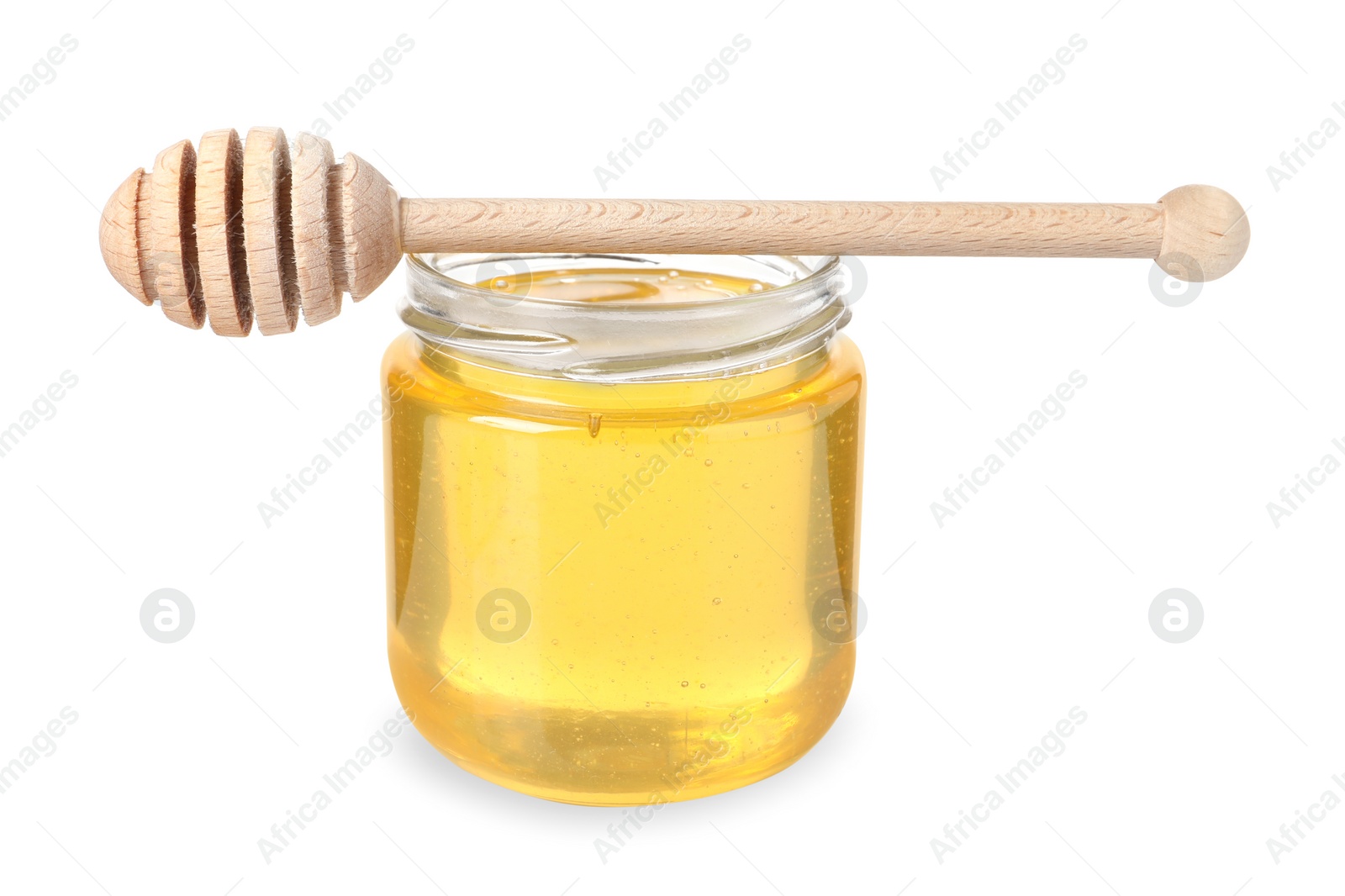 Photo of Tasty honey in glass jar and dipper isolated on white