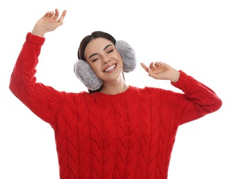 Photo of Beautiful young woman wearing earmuffs on white background