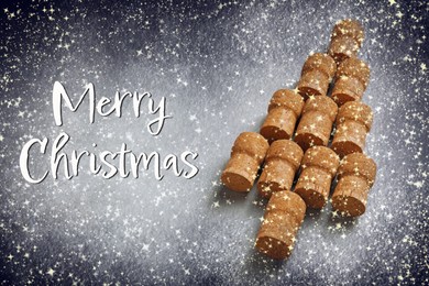 Image of Christmas tree made of sparkling wine corks on light grey table