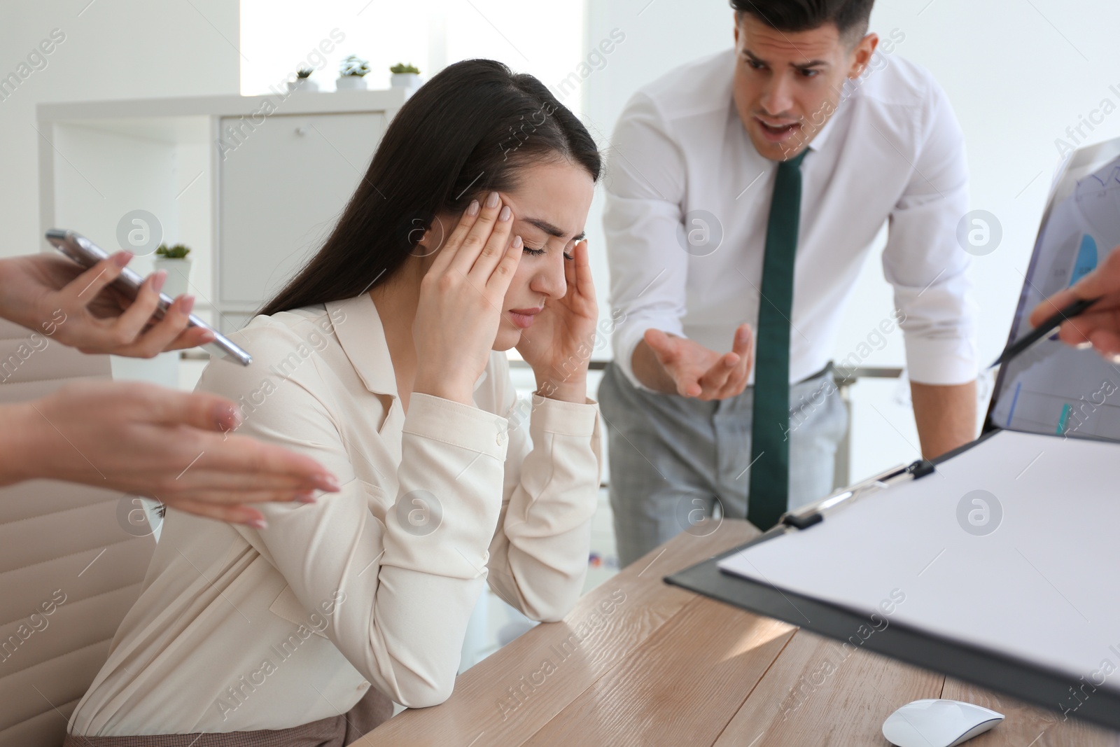 Photo of Businesswoman stressing out at workplace in office