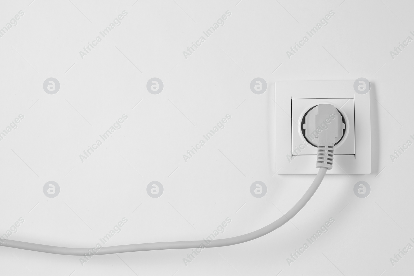 Photo of Power socket and plug on white background. Electrician's equipment