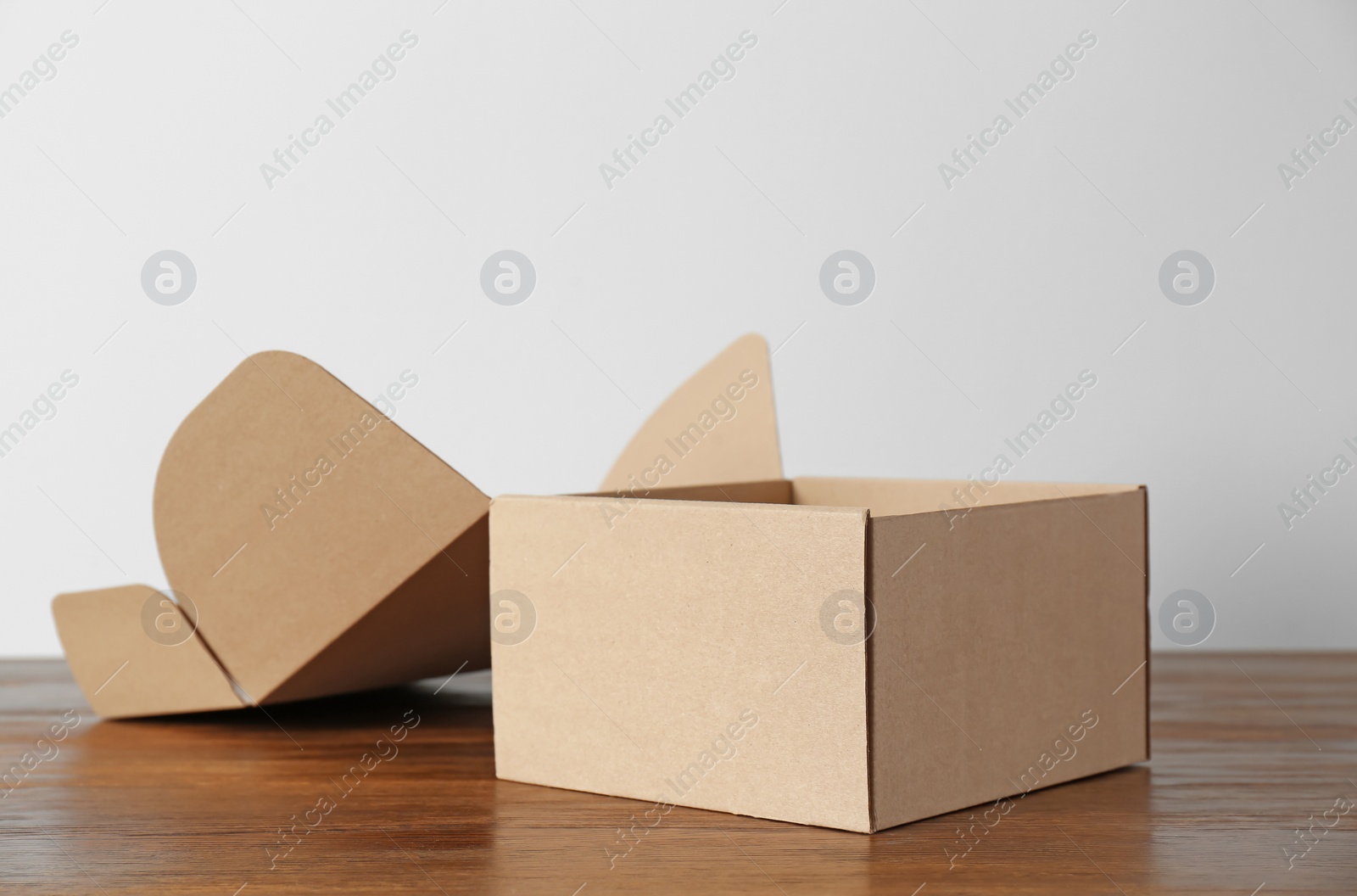 Photo of Cardboard box on wooden table