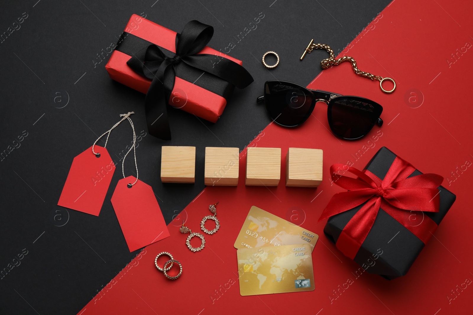 Photo of Blank wooden cubes, gift boxes, credit cards and fashionable accessories on color background, flat lay
