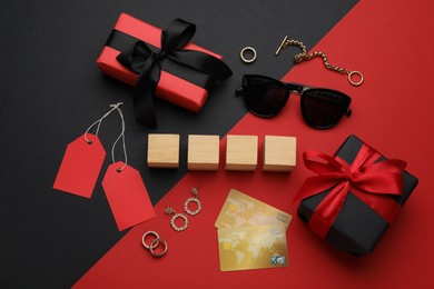 Photo of Blank wooden cubes, gift boxes, credit cards and fashionable accessories on color background, flat lay