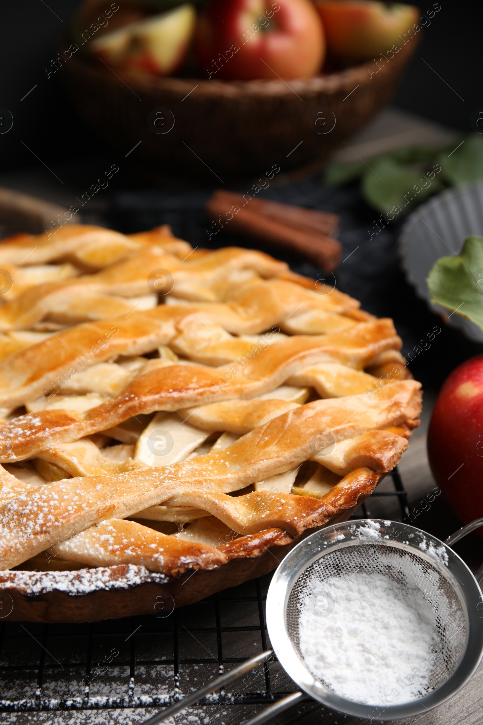 Photo of Delicious traditional apple pie on table, closeup