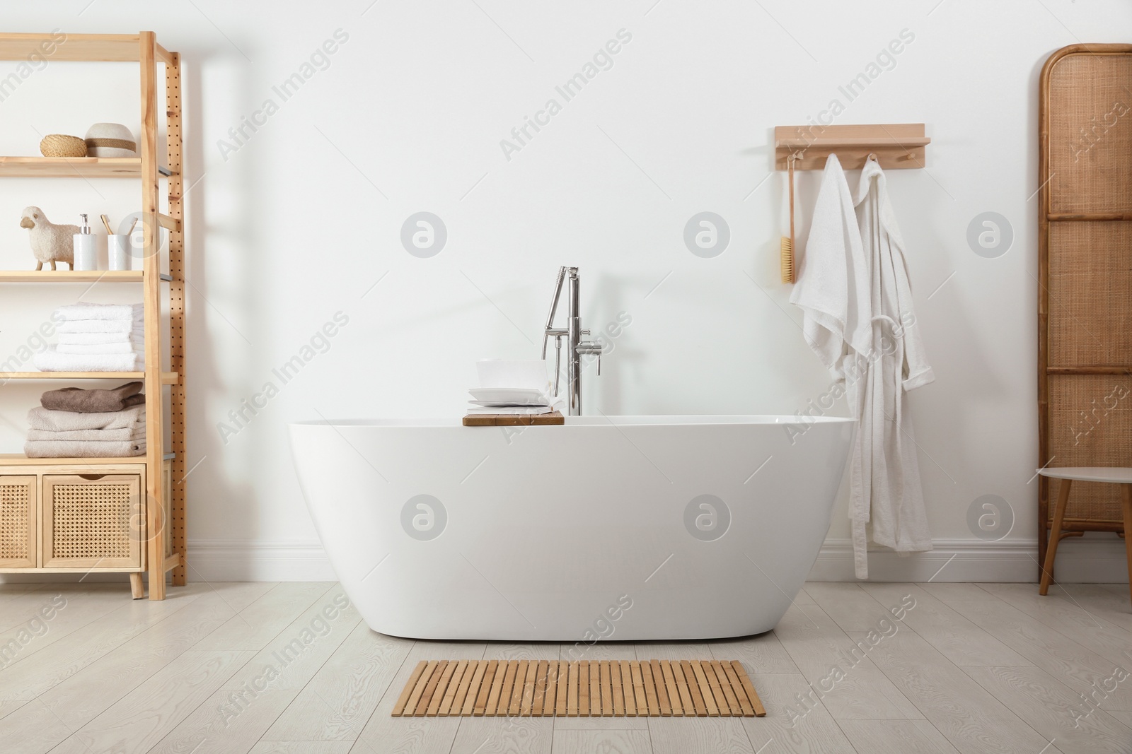 Photo of Stylish bathroom interior with modern white tub