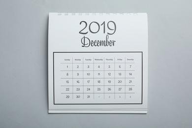 Photo of December 2019 calendar on light grey background, top view