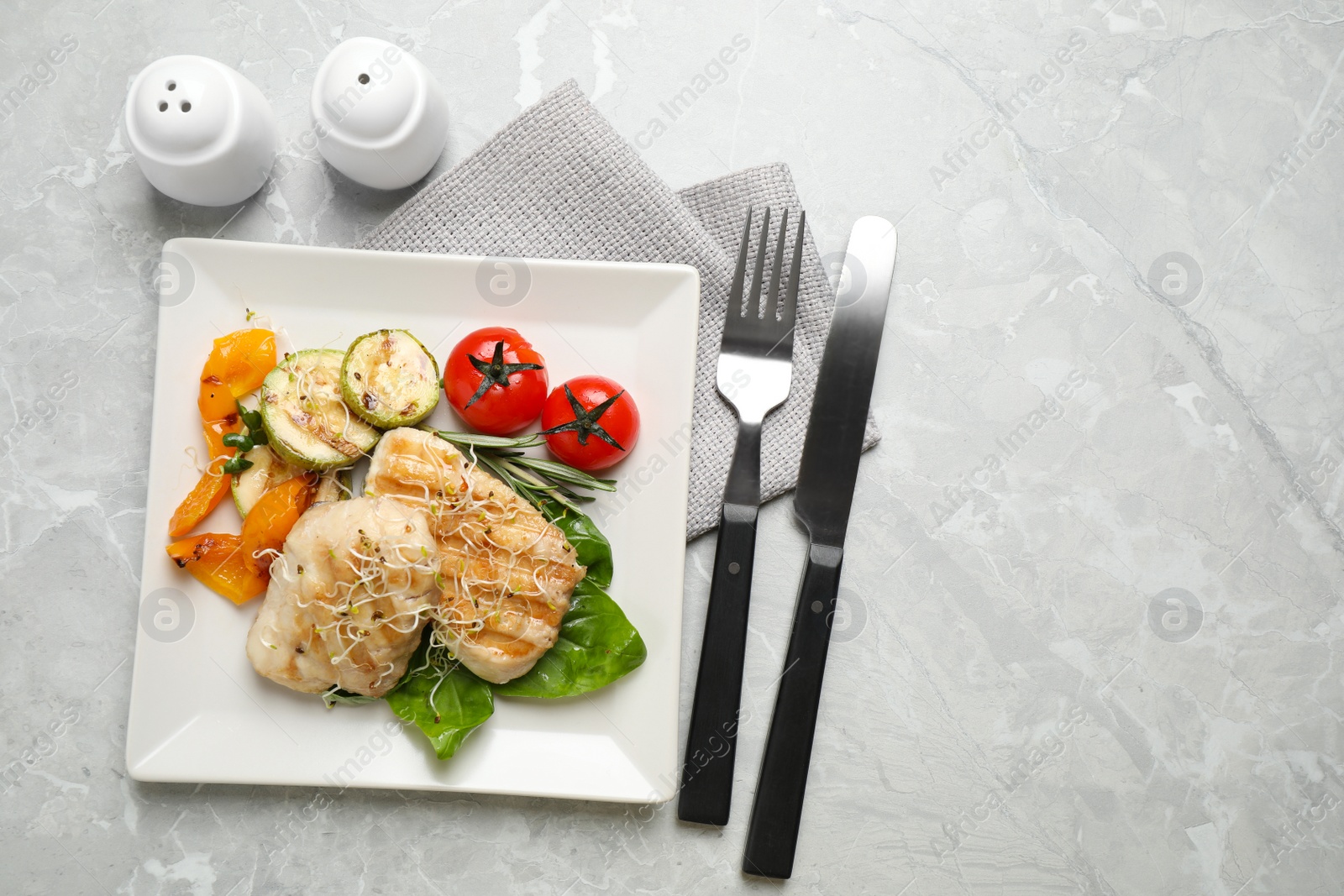 Photo of Flat lay composition with grilled fish on light grey marble table