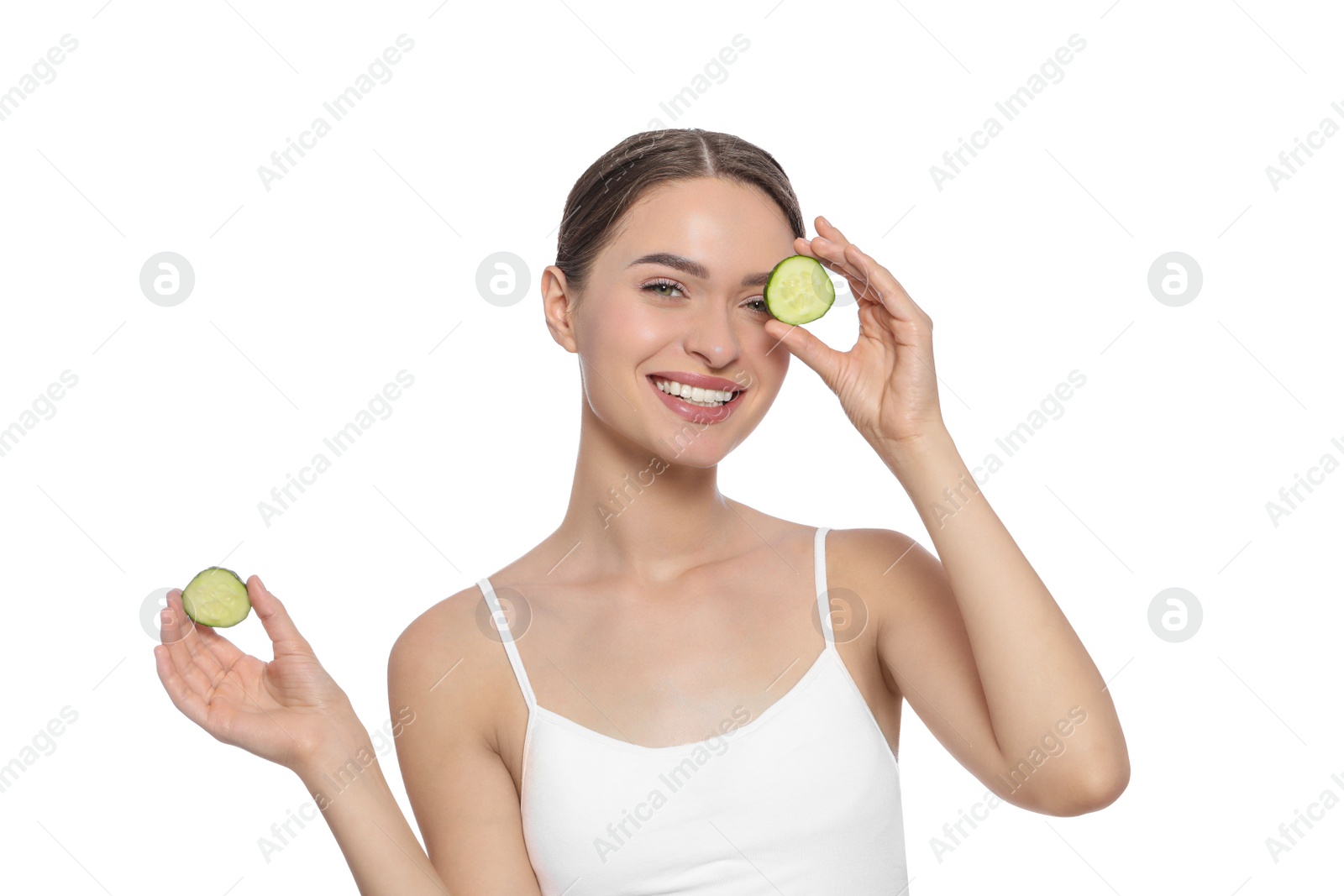 Photo of Young woman with cucumber slices on white background. Eye skin care