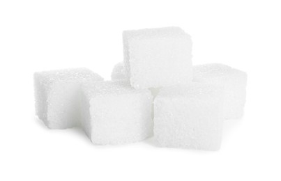 Photo of Many refined sugar cubes isolated on white