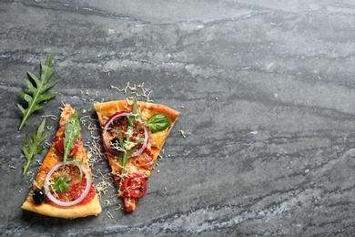 Flat lay composition with slices of tasty homemade pizza and space for text on table