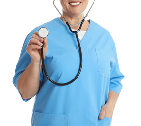 Mature doctor with stethoscope on white background, closeup