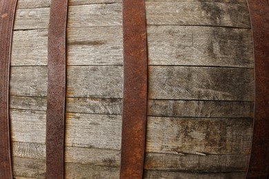 Traditional wooden barrel as background, closeup. Wine making