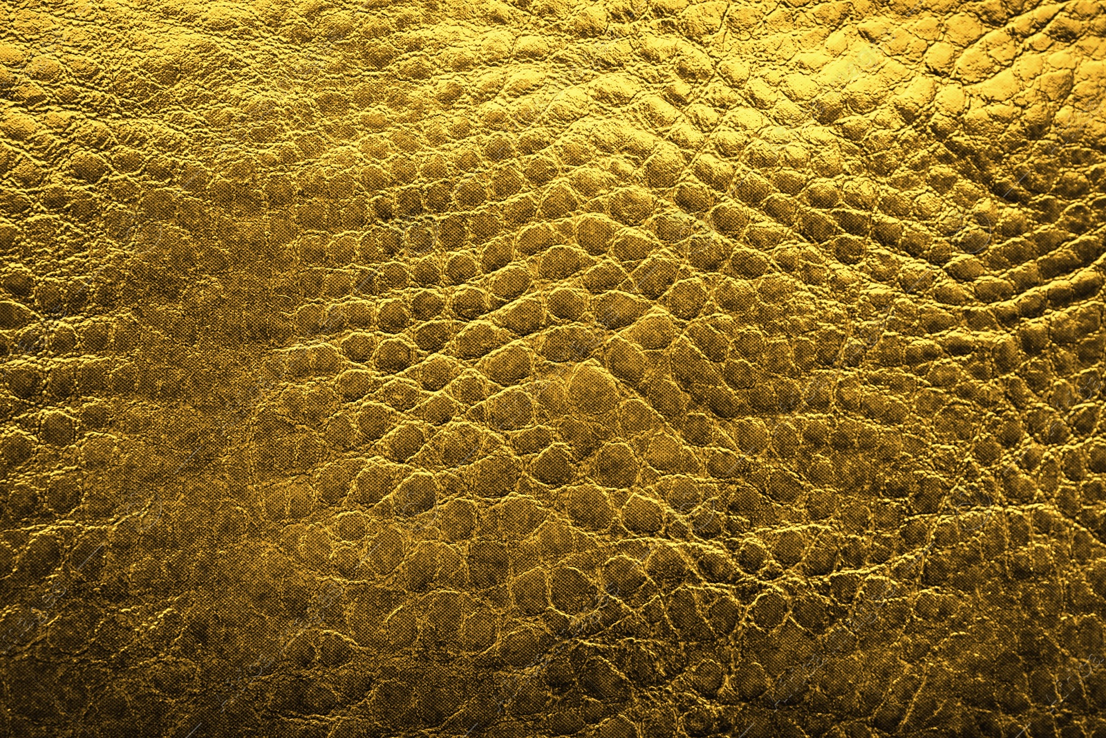 Image of Golden textured surface as background, closeup view