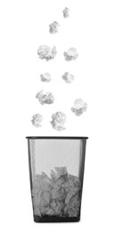 Image of Crumpled paper falling into trash bin on white background