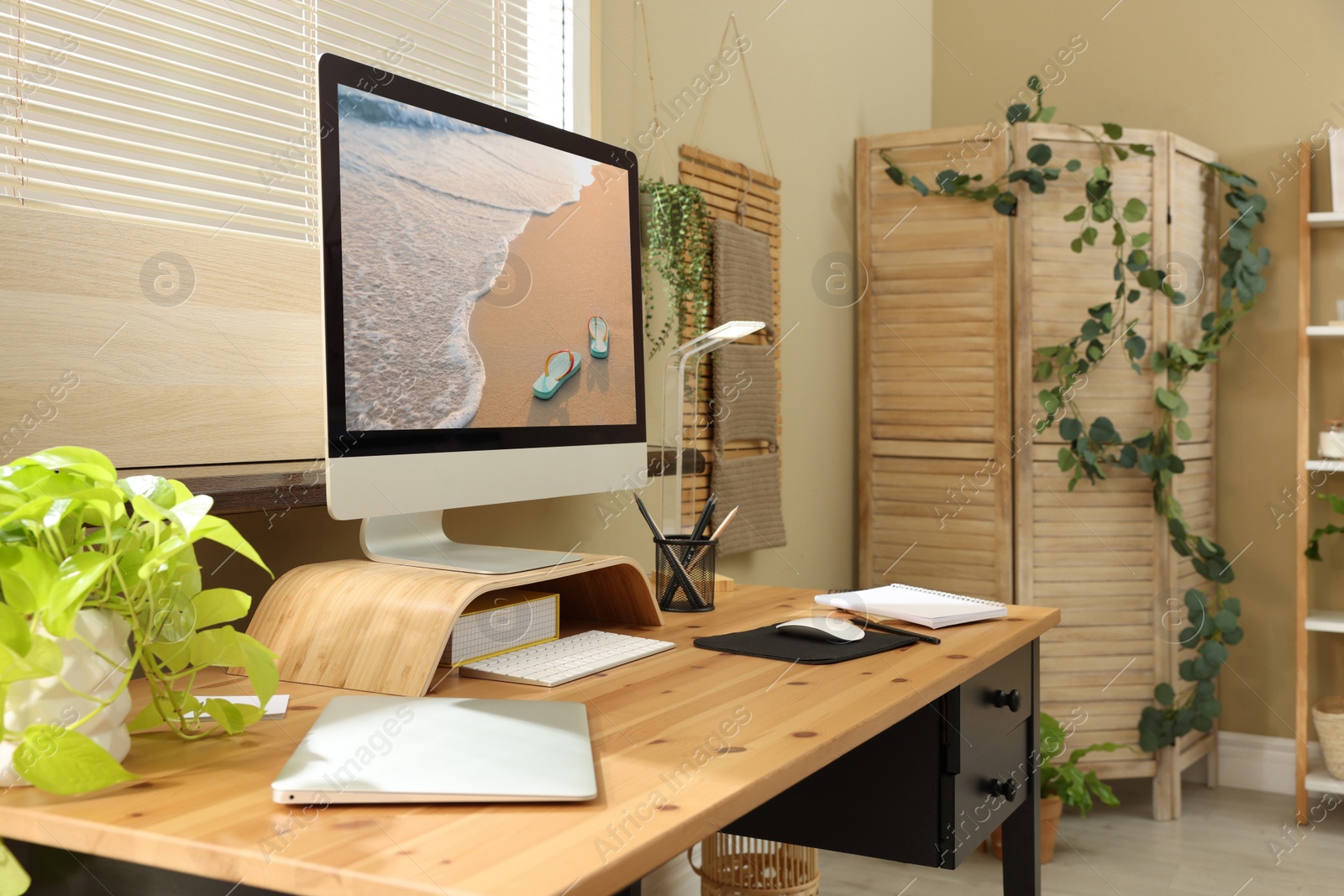 Photo of Light room interior with comfortable workplace near window