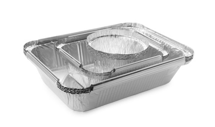 Photo of Many different aluminum foil containers isolated on white