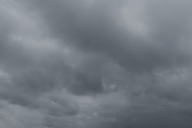 Sky with heavy rainy clouds on grey day